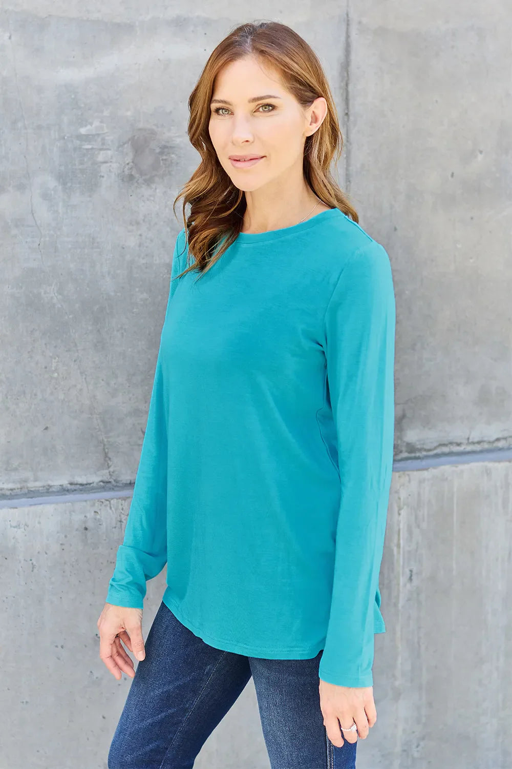 Women's long sleeve round neck top by ShopBasicbae, shown in a comfortable, fitted style with soft fabric and classic design.
