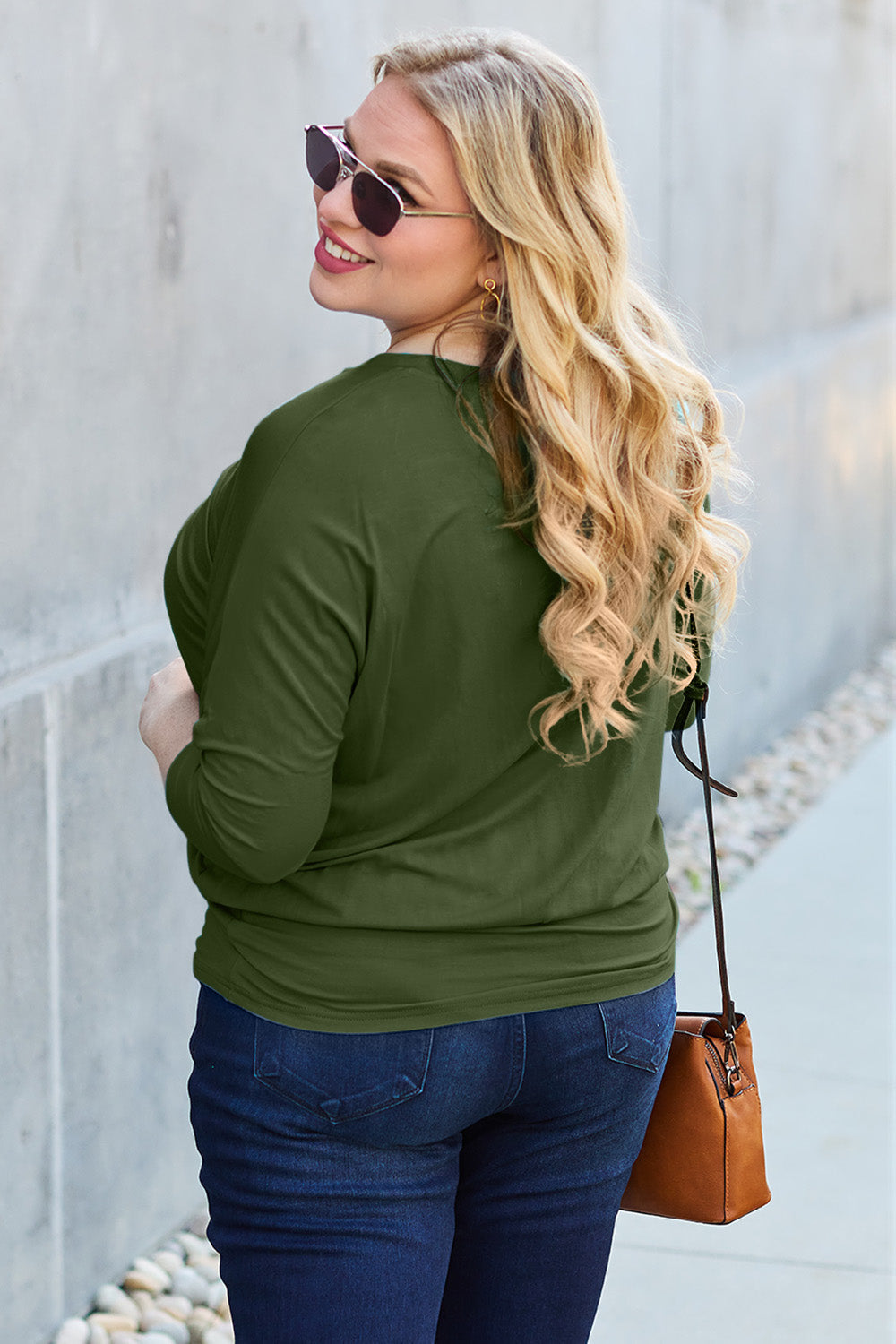 ShopBasicbae Basic Bae full-size round neck batwing sleeve top, featuring a relaxed fit and soft fabric, shown on a hanger.