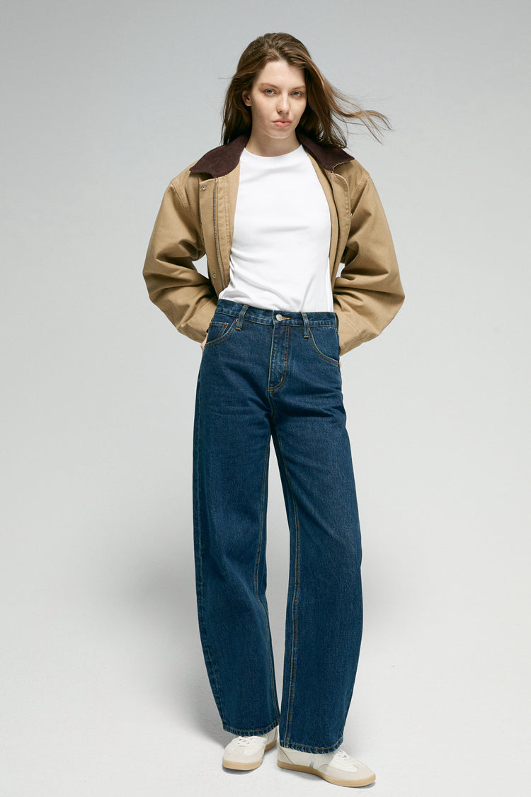 Hey Joanie Slope Curve Jeans in light wash with high-rise fit and classic five-pocket design, shown on a model.