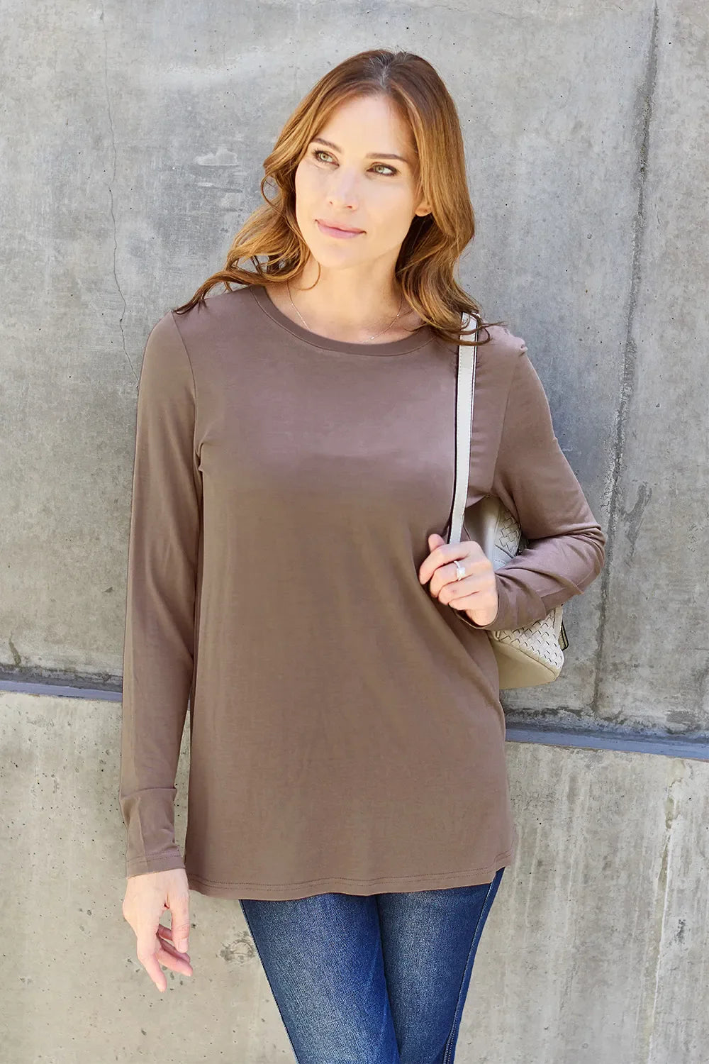 Women's ShopBasicbae round neck long sleeve top, lightweight and fitted, shown in a close-up image highlighting the fabric and neckline.