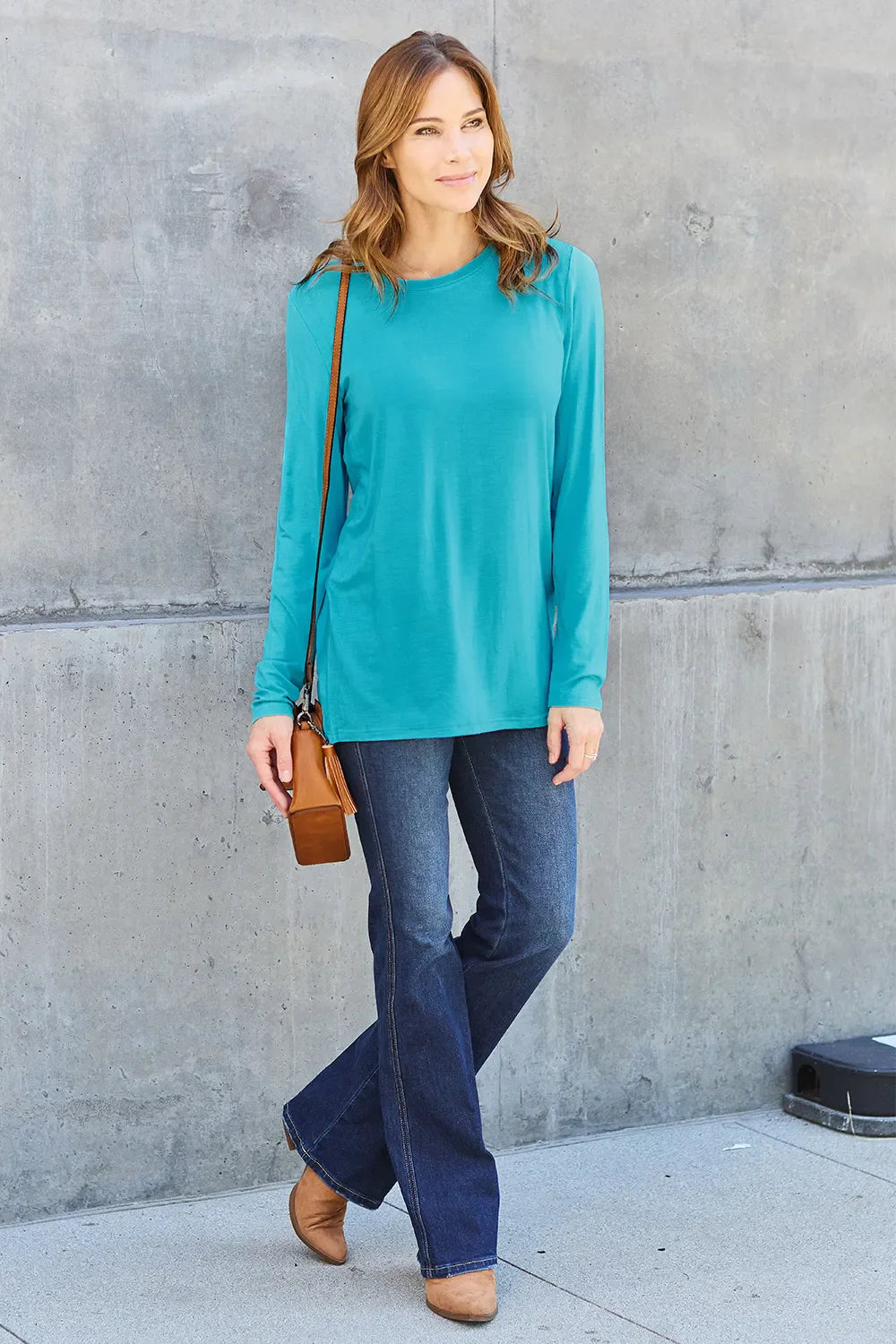 Women's round neck long sleeve top by ShopBasicbae, featuring a fitted design and soft fabric in a neutral color.