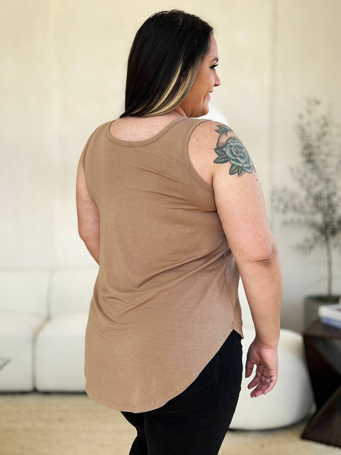 ShopBasicbae Basic Bae full-size round neck tank top with curved hem, made of soft fabric, shown on a model.