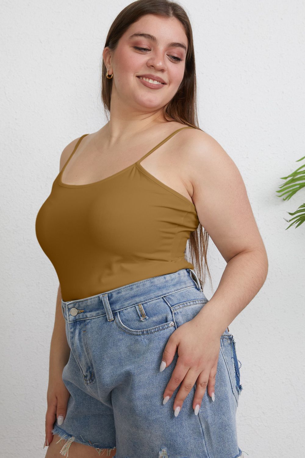 ShopBasicbae Basic Bae full-size round neck slim camisole top in black, displayed flat with smooth fabric and slim fit design.