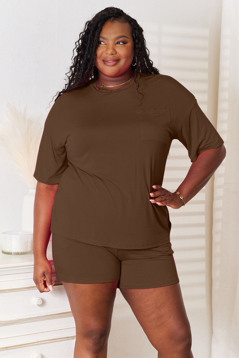ShopBasicbae Basic Bae full-size soft rayon half sleeve top and shorts set, with a relaxed fit and comfortable fabric.