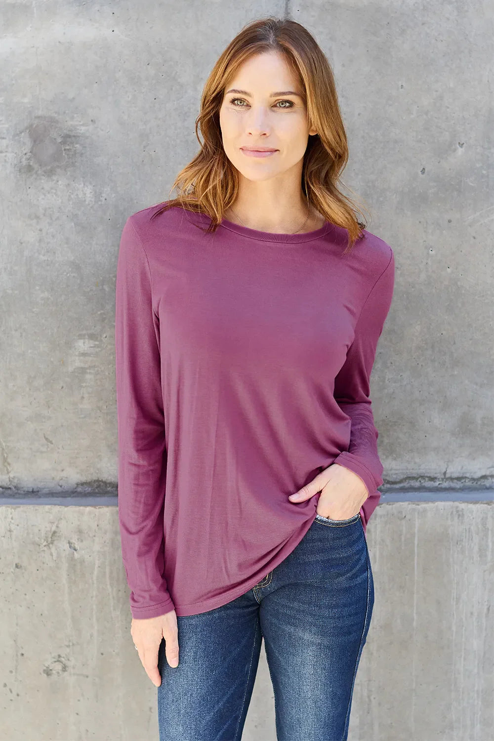 Women's round neck long sleeve top by ShopBasicbae, shown in a soft fabric with a fitted silhouette and long sleeves.