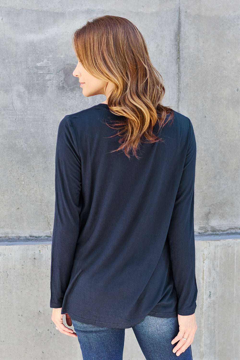 Basic Bae full size V-neck long sleeve top, black, soft fabric, and fitted silhouette, shown on a mannequin.