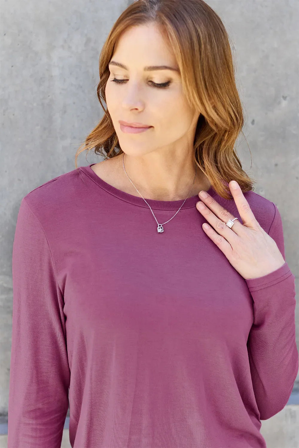 Women's round neck long sleeve top by ShopBasicbae, shown in a casual fit with soft fabric and classic design.