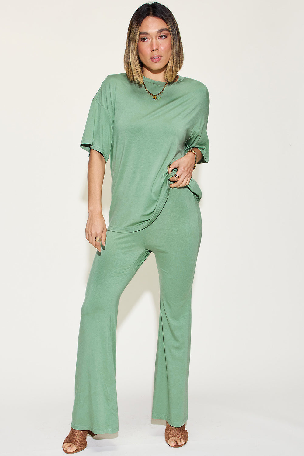 Basic Bae bamboo drop shoulder T-shirt and flare pants set, featuring a relaxed fit in soft bamboo fabric, displayed on a mannequin.