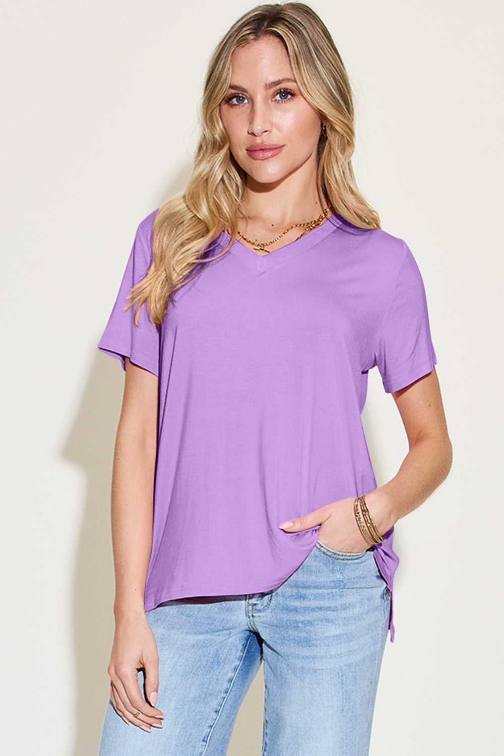 ShopBasicbae bamboo full-size v-neck high-low t-shirt, casual tops in natural bamboo fabric with a relaxed fit and stylish design.