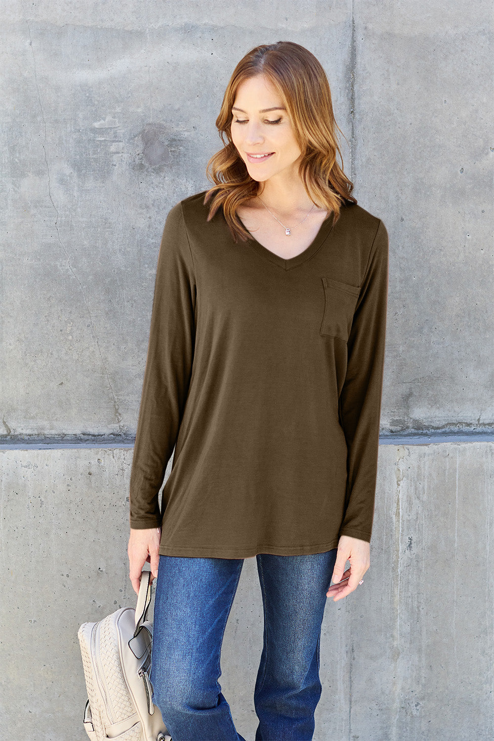 ShopBasicbae Basic Bae long sleeve V-neck top in a solid color, featuring a relaxed fit and classic neckline.