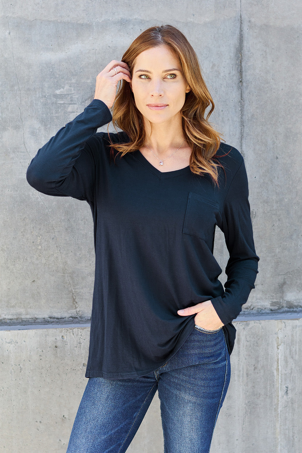 ShopBasicbae Basic Bae long sleeve V-neck top, full size, in a versatile solid color, shown on a model.