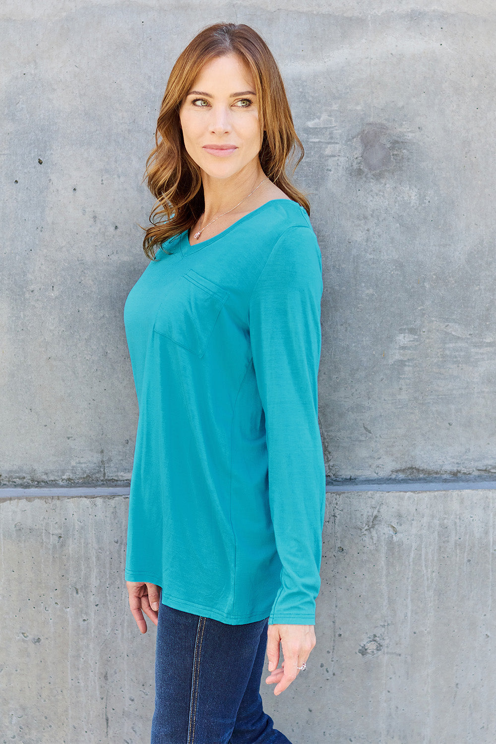 ShopBasicbae Basic Bae full-size v-neck long sleeve top in black, featuring a comfortable fit and classic design.