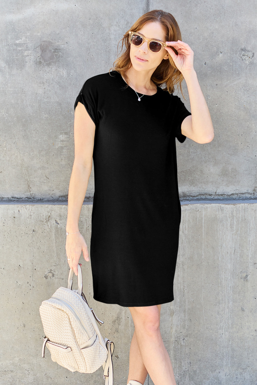 ShopBasicbae bamboo full-size round neck short sleeve dress with pockets, showcasing a casual, lightweight, eco-friendly design.