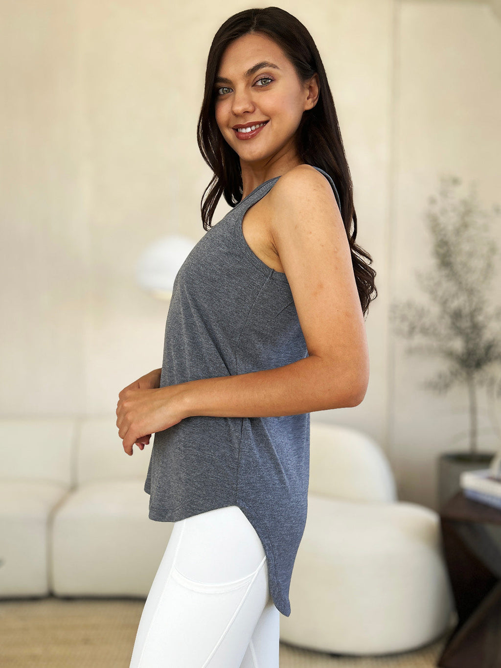 ShopBasicbae Basic Bae full-size round neck tank top with curved hem, showing the soft fabric and relaxed fit.