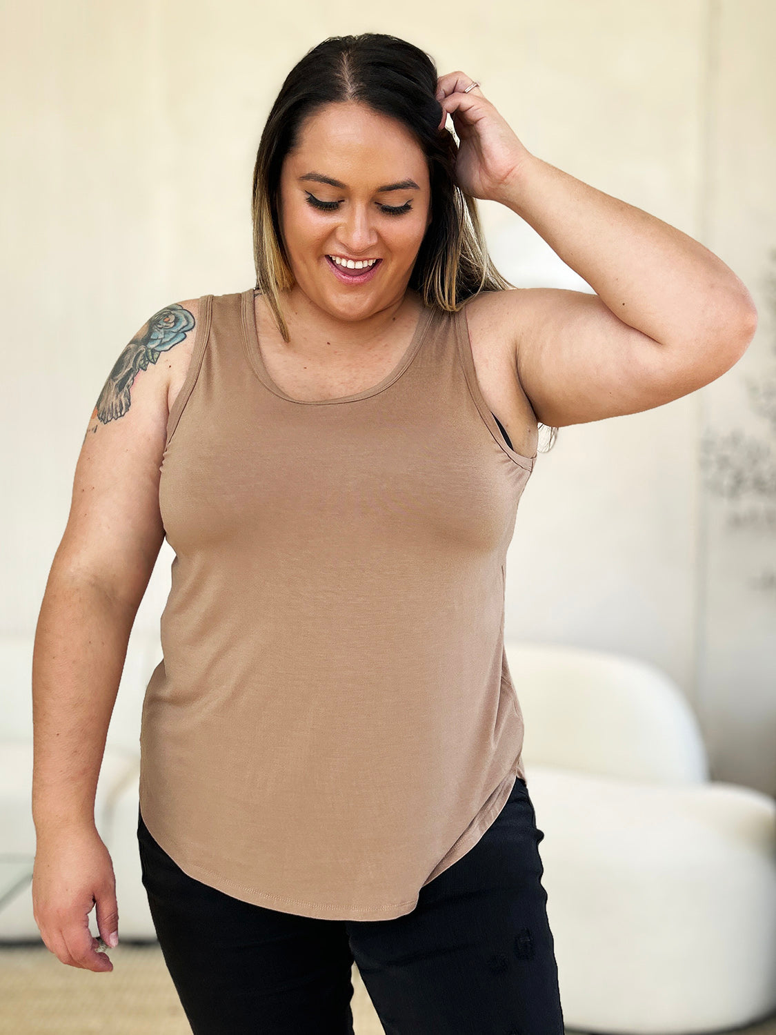 ShopBasicbae Basic Bae round neck curved hem tank top, full size, casual sleeveless top in soft fabric, shown on model.