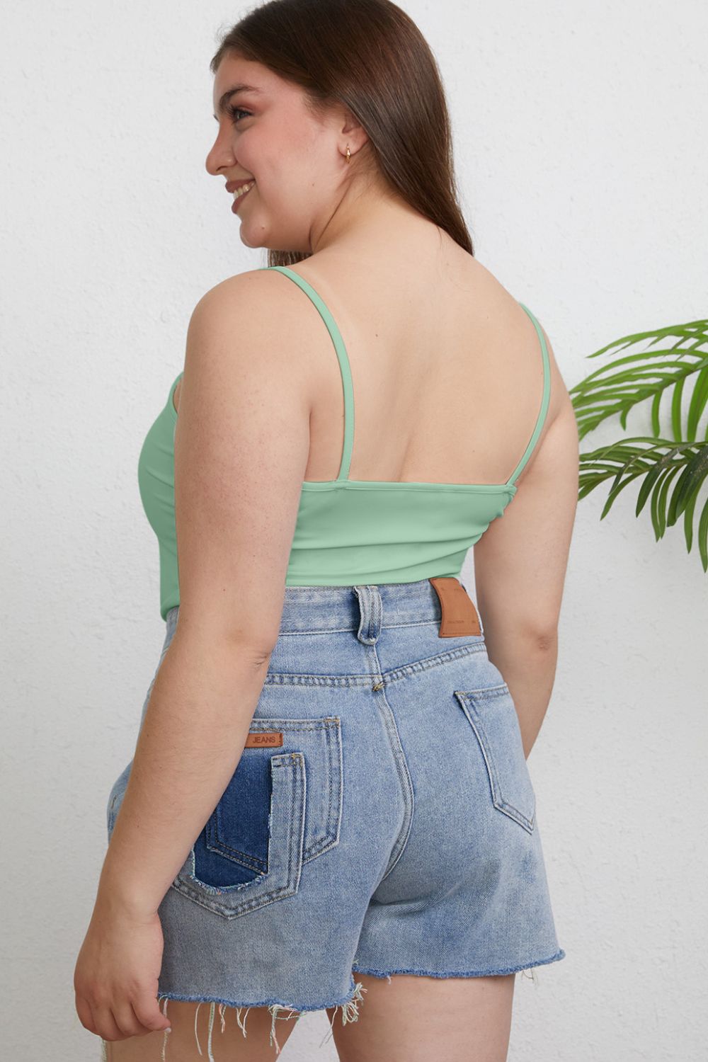 ShopBasicbae Basic Bae full size round neck slim camisole top in a solid color, close-up of the fitted, sleeveless design.