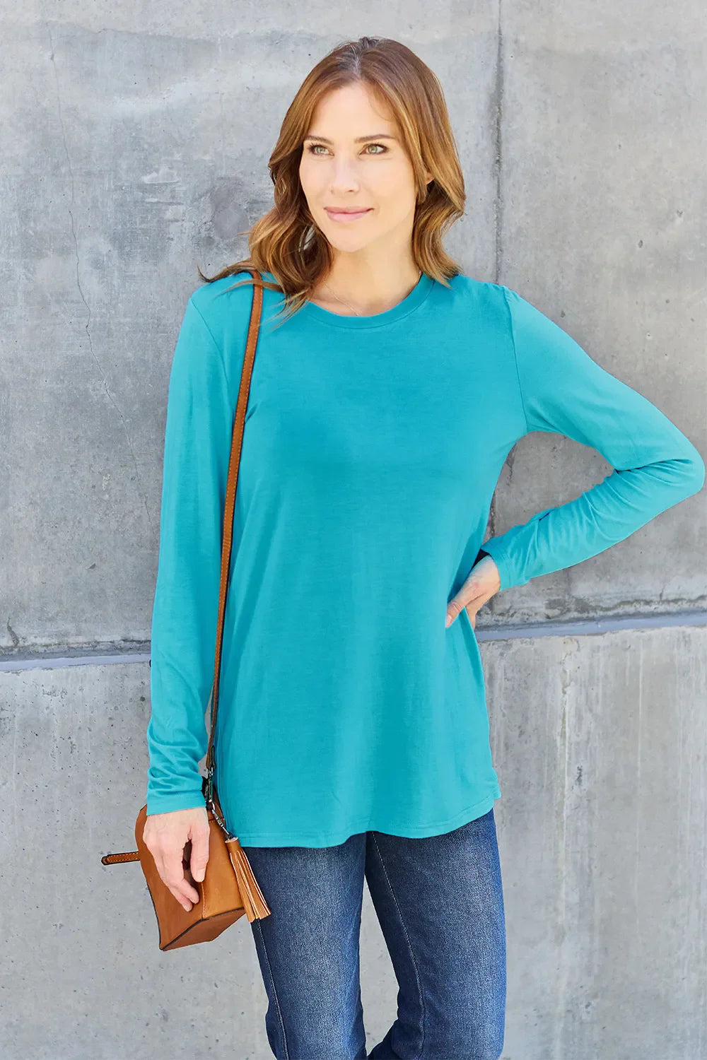 Women's long sleeve round neck top by ShopBasicbae, shown in a close-up image highlighting the soft fabric and classic fit.