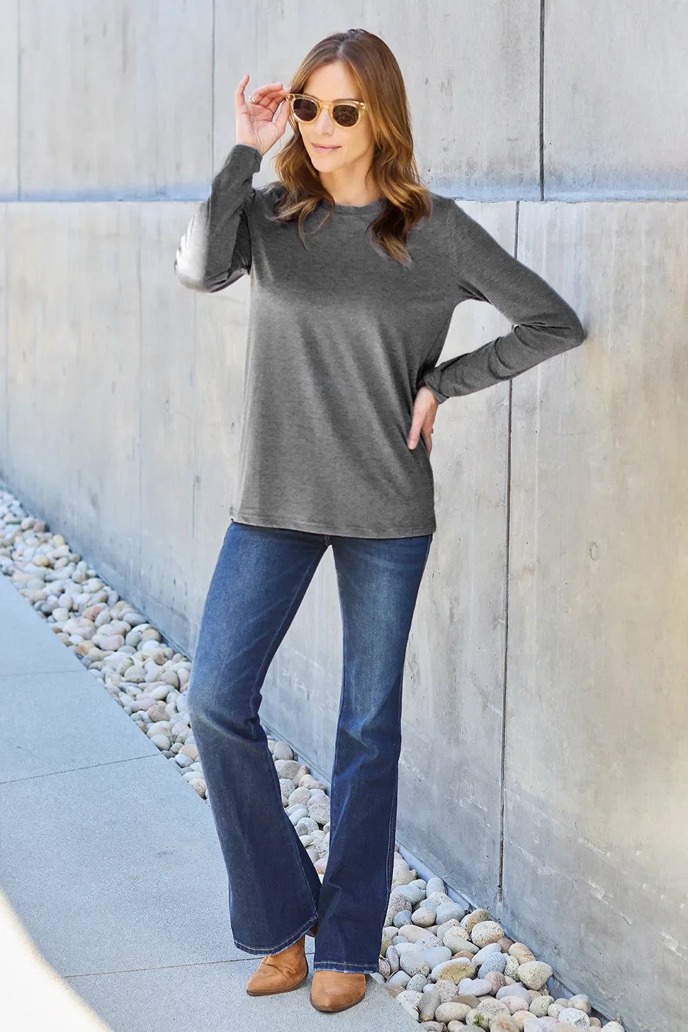 Women’s long sleeve round neck top by ShopBasicbae, shown in a soft fabric with a fitted silhouette and classic design.