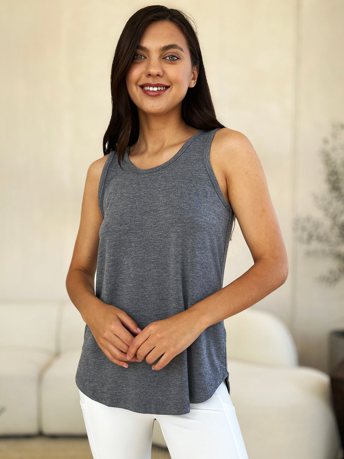 ShopBasicbae Basic Bae full size round neck curved hem tank top, casual sleeveless top with curved hem and relaxed fit.