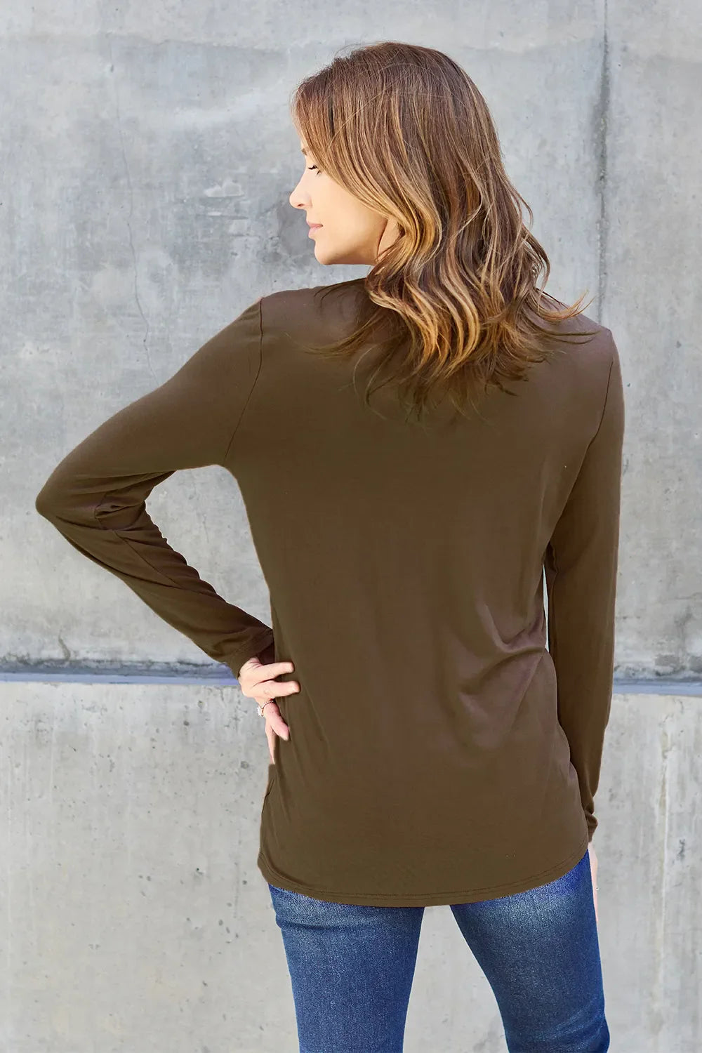 Women's round neck long sleeve top by ShopBasicbae, shown in a neutral color with a comfortable fit and soft fabric.