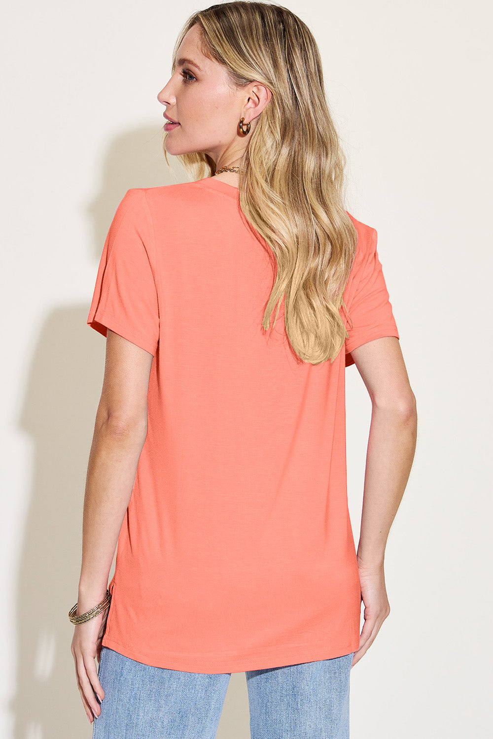 ShopBasicbae Bamboo V-Neck High-Low T-Shirt, full-size basic Bae tops in natural bamboo fabric, displayed on a hanger.