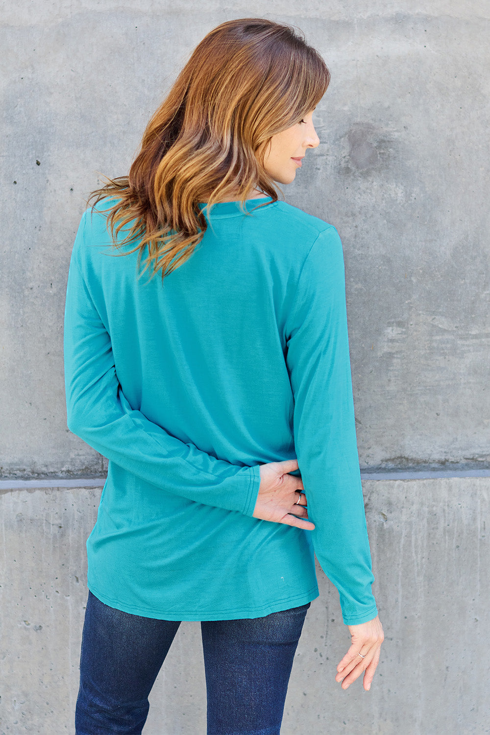 ShopBasicbae Basic Bae V-Neck Long Sleeve Top, full-size, black, lightweight knit with a relaxed fit and long sleeves.