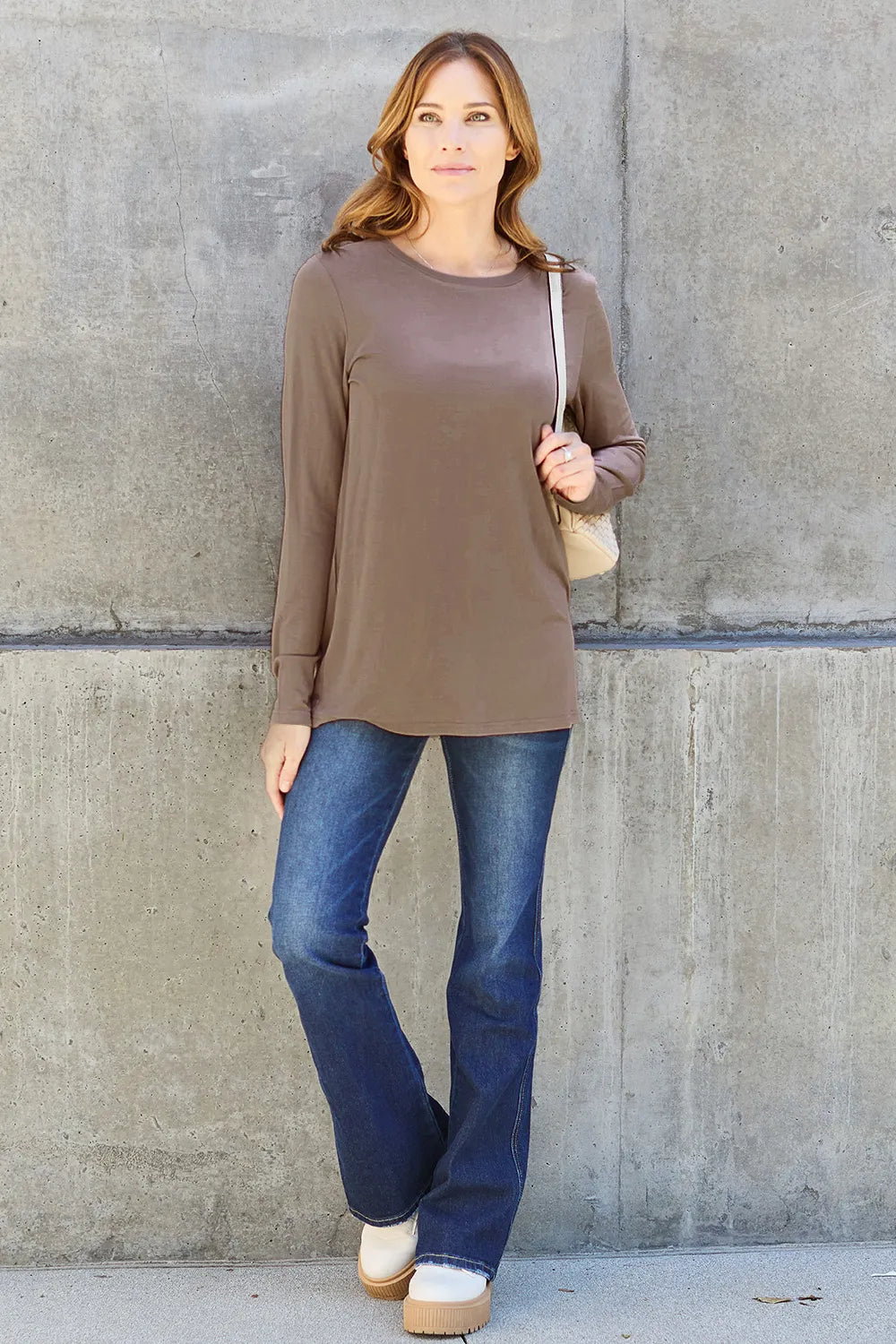 Women's long sleeve round neck top by ShopBasicbae, shown in black with a fitted style and soft fabric.