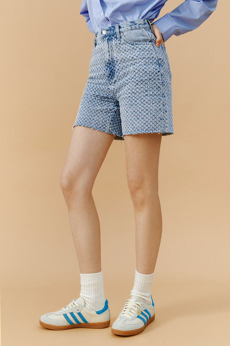 Hey Joanie Venice Tweed High Rise Shorts in beige, showcasing the textured fabric and high waist design.