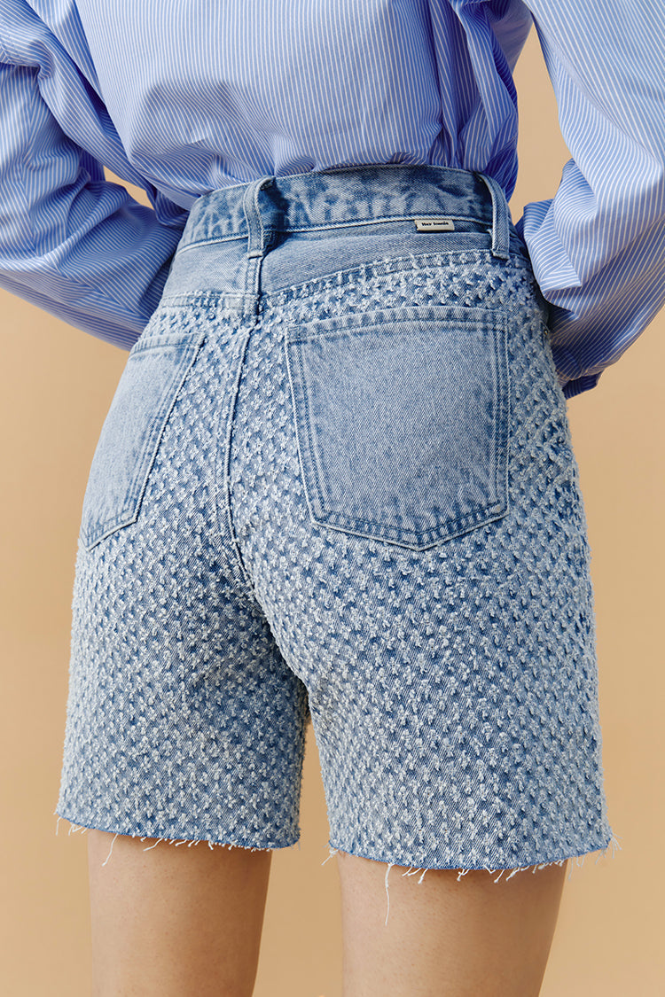 Hey Joanie Venice Tweed High Rise Shorts in beige, featuring a textured tweed fabric and high waist design.