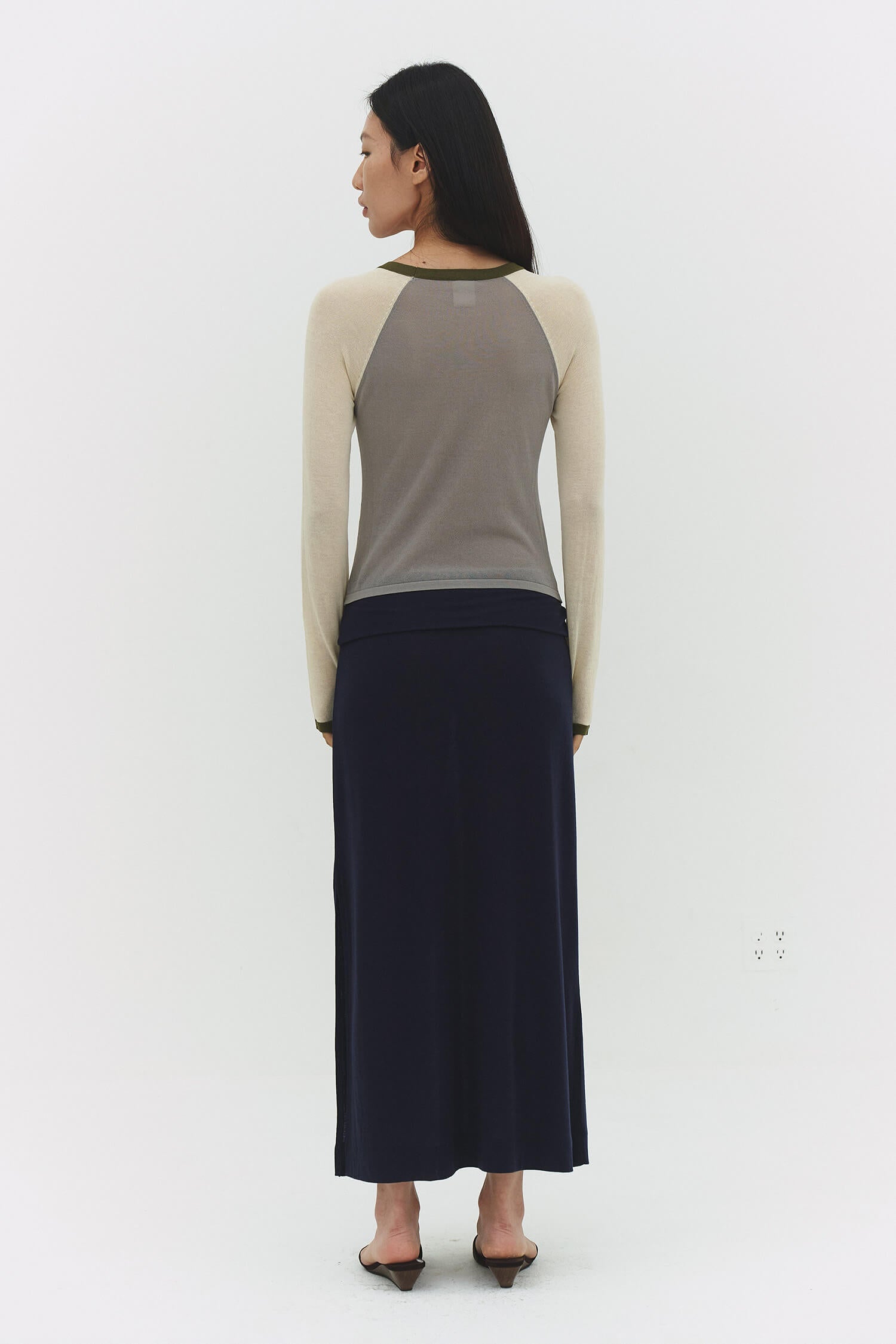 Findmenowthelabel Miraine Raglan Top in Matcha Mel featuring vintage khaki and dark olive color blocks, casual and stylish.