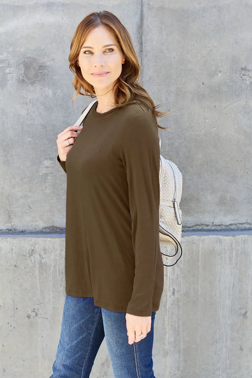 Women's long sleeve round neck top by ShopBasicbae, shown in a neutral color, fitted style, and soft fabric.