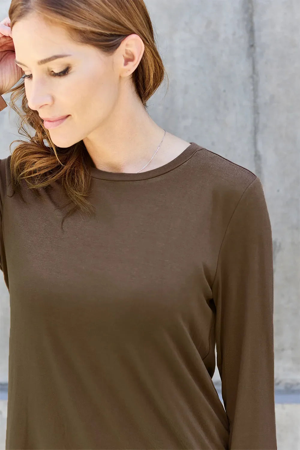 Women's round neck long sleeve top by ShopBasicbae, featuring a comfortable fit and classic design in a soft fabric.