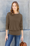 ShopBasicbae Basic Bae full-size round neck batwing sleeve top, featuring a relaxed fit and soft fabric, shown on a model.