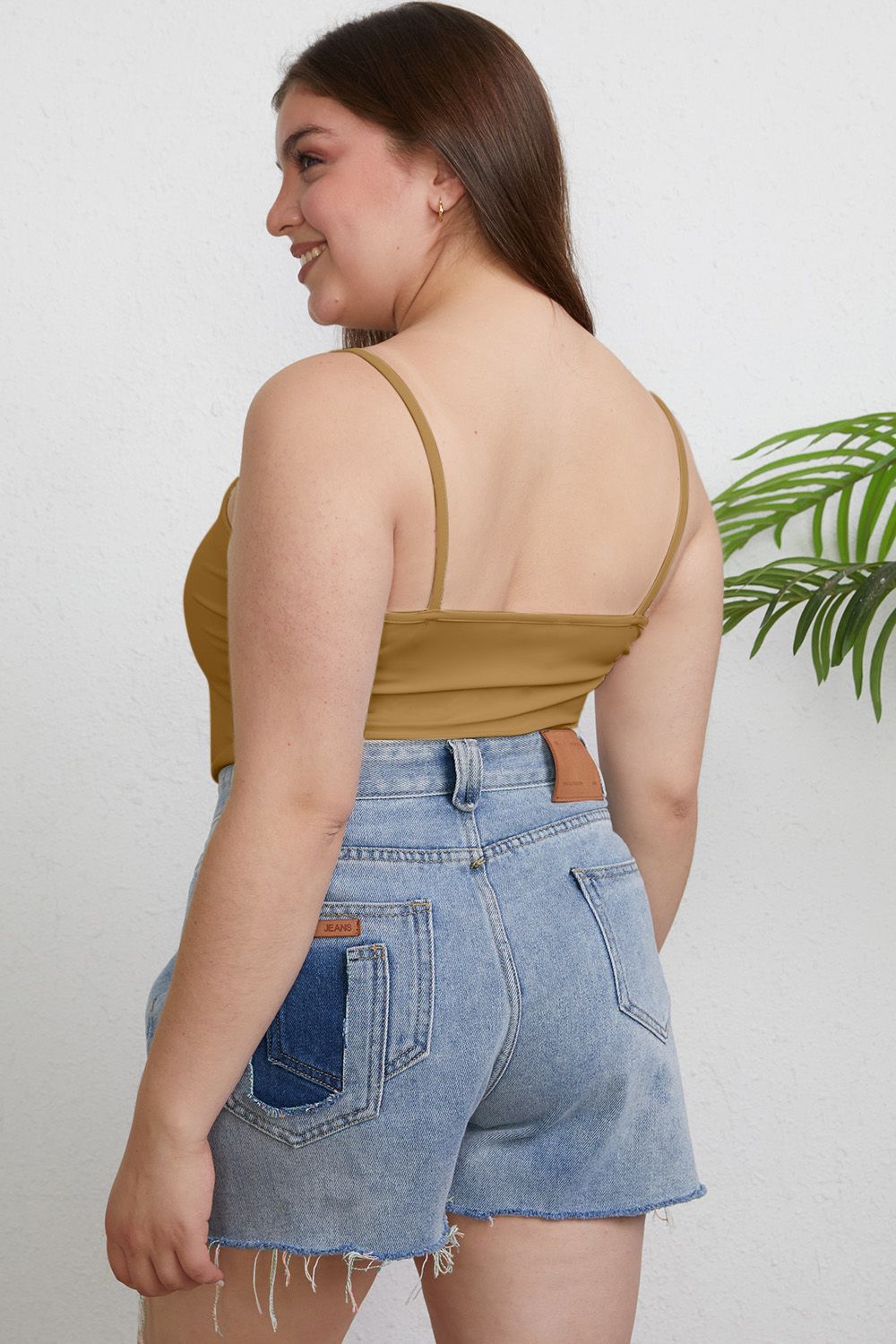 ShopBasicbae Basic Bae full size round neck slim cami top, soft fabric, fitted style, in a neutral color, displayed on a hanger.
