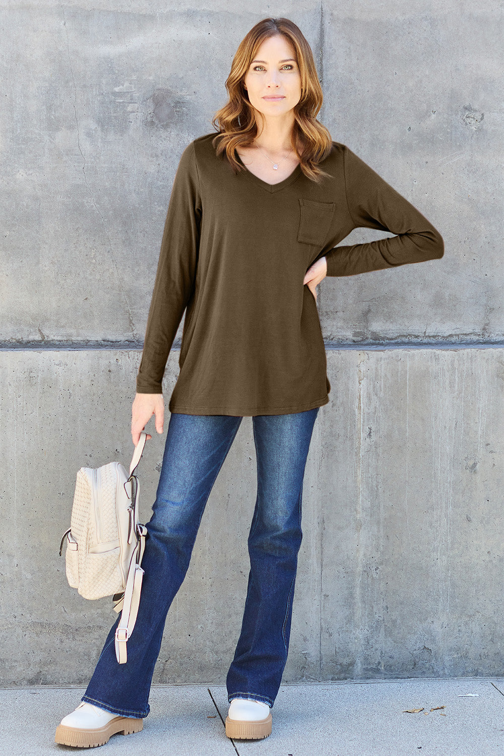ShopBasicbae Basic Bae V-Neck Long Sleeve Top, full-size, black with a fitted V-neck design and long sleeves, laid flat.