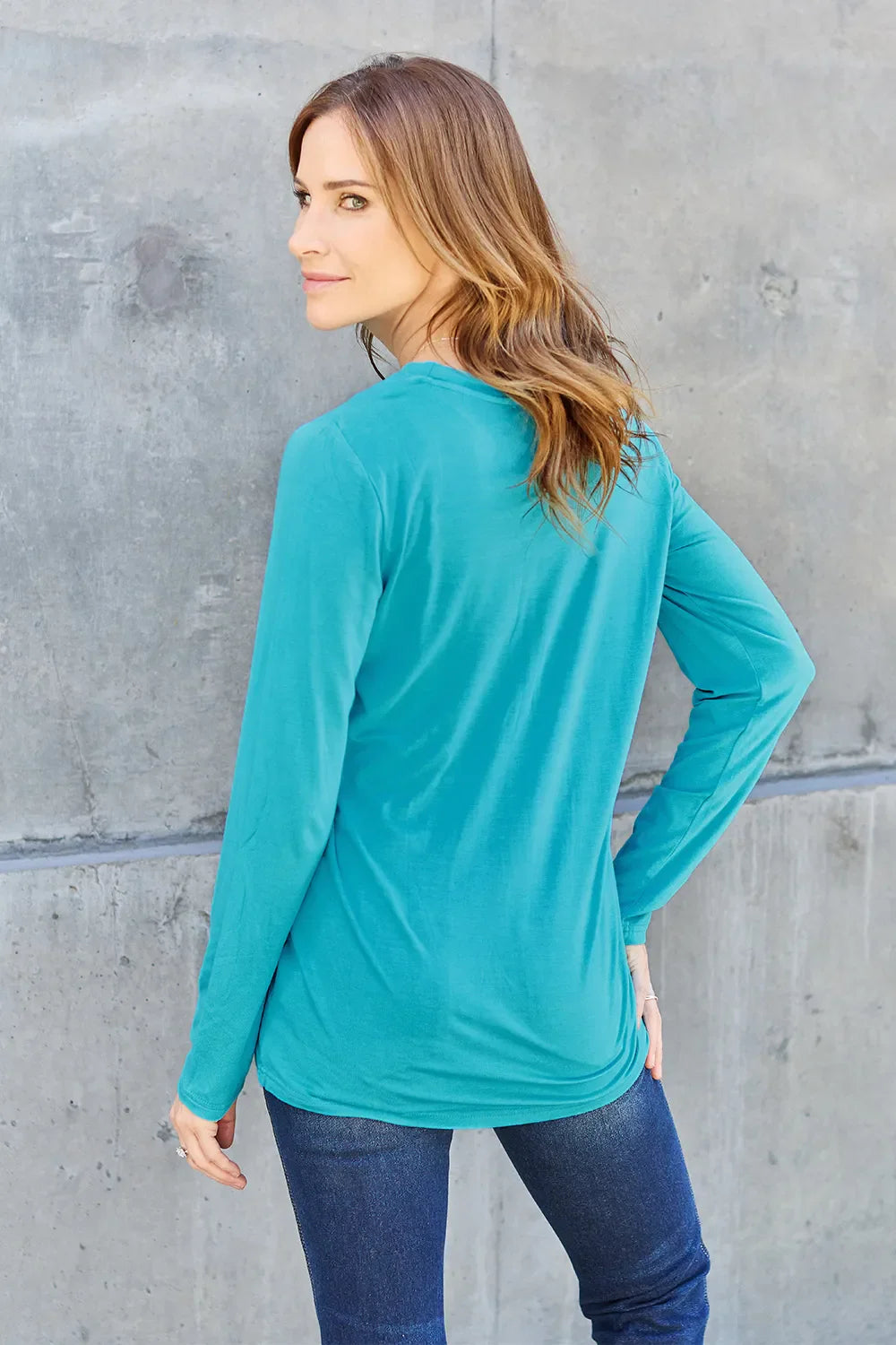 Women's long sleeve round neck top by ShopBasicbae, shown in a casual fit with soft fabric and simple design.