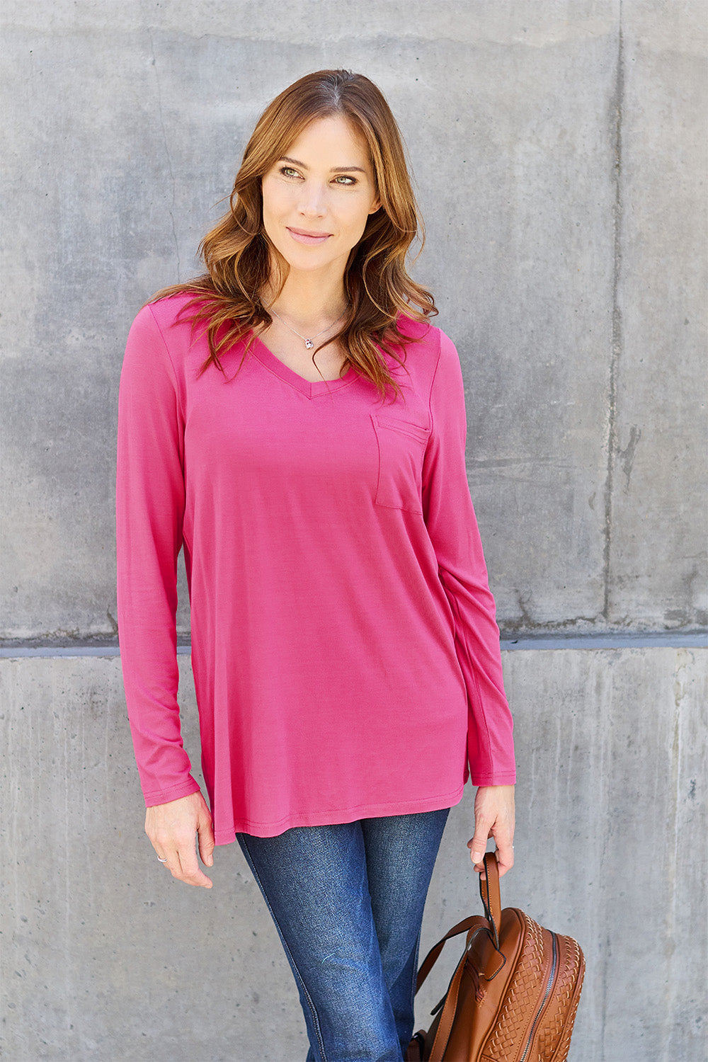 ShopBasicbae Basic Bae long sleeve V-neck top in a solid color, featuring a relaxed fit and comfortable fabric.