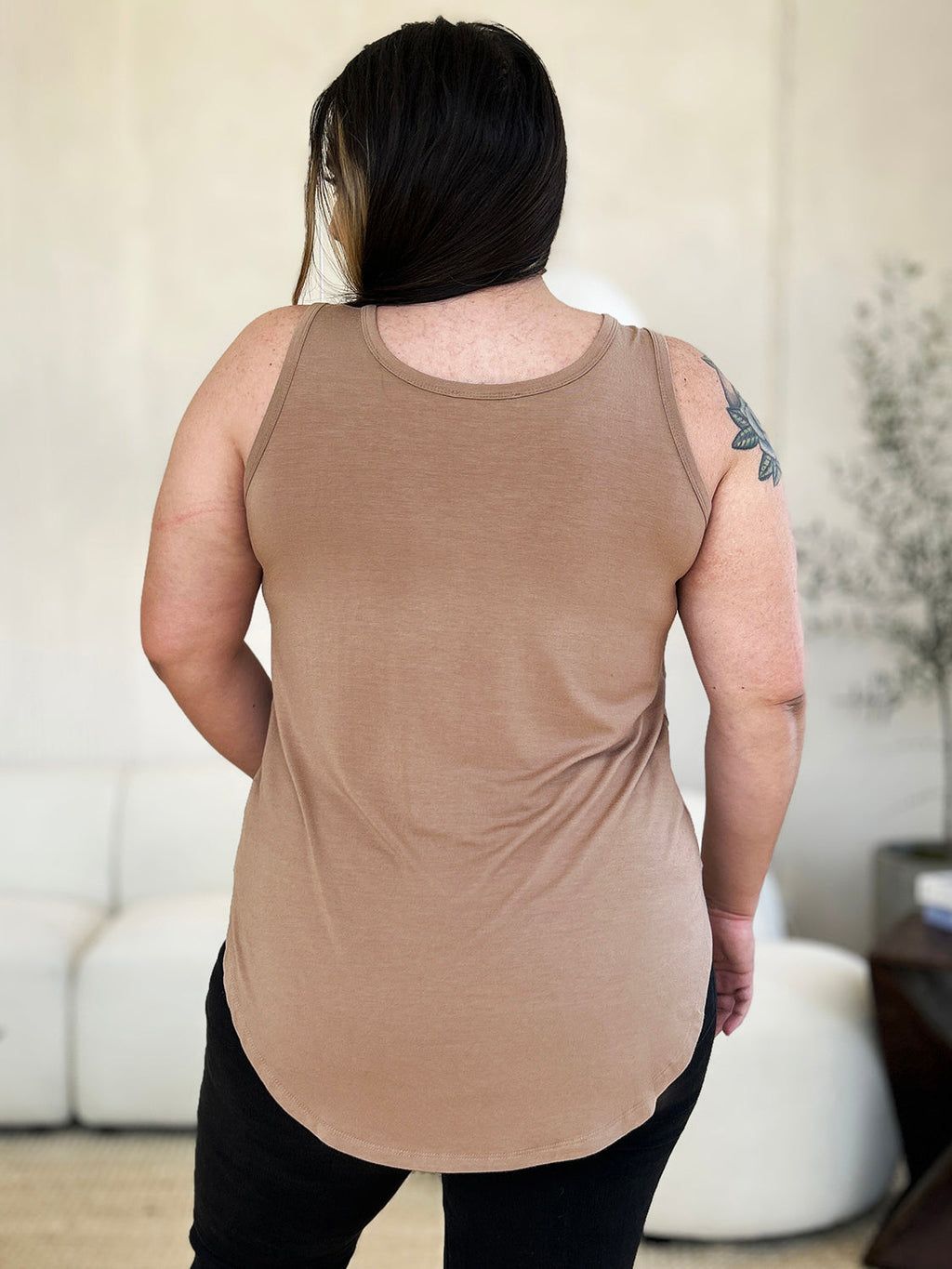 ShopBasicbae Basic Bae full-size round neck curved hem tank top, beige color, soft fabric, casual sleeveless design.