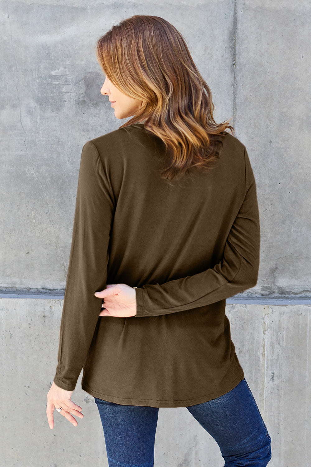 ShopBasicbae Basic Bae full-size V-neck long sleeve top, shown in natural fabric with a relaxed fit and classic V-neck design.