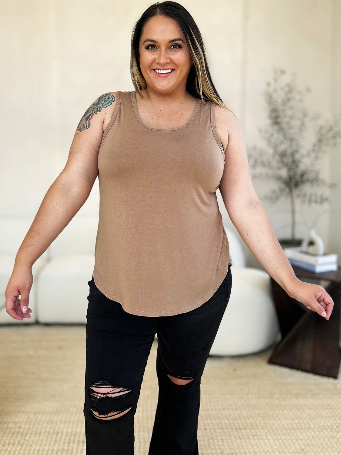 ShopBasicbae Basic Bae full-size round neck tank top with curved hem, shown in a casual, sleeveless design in the image.