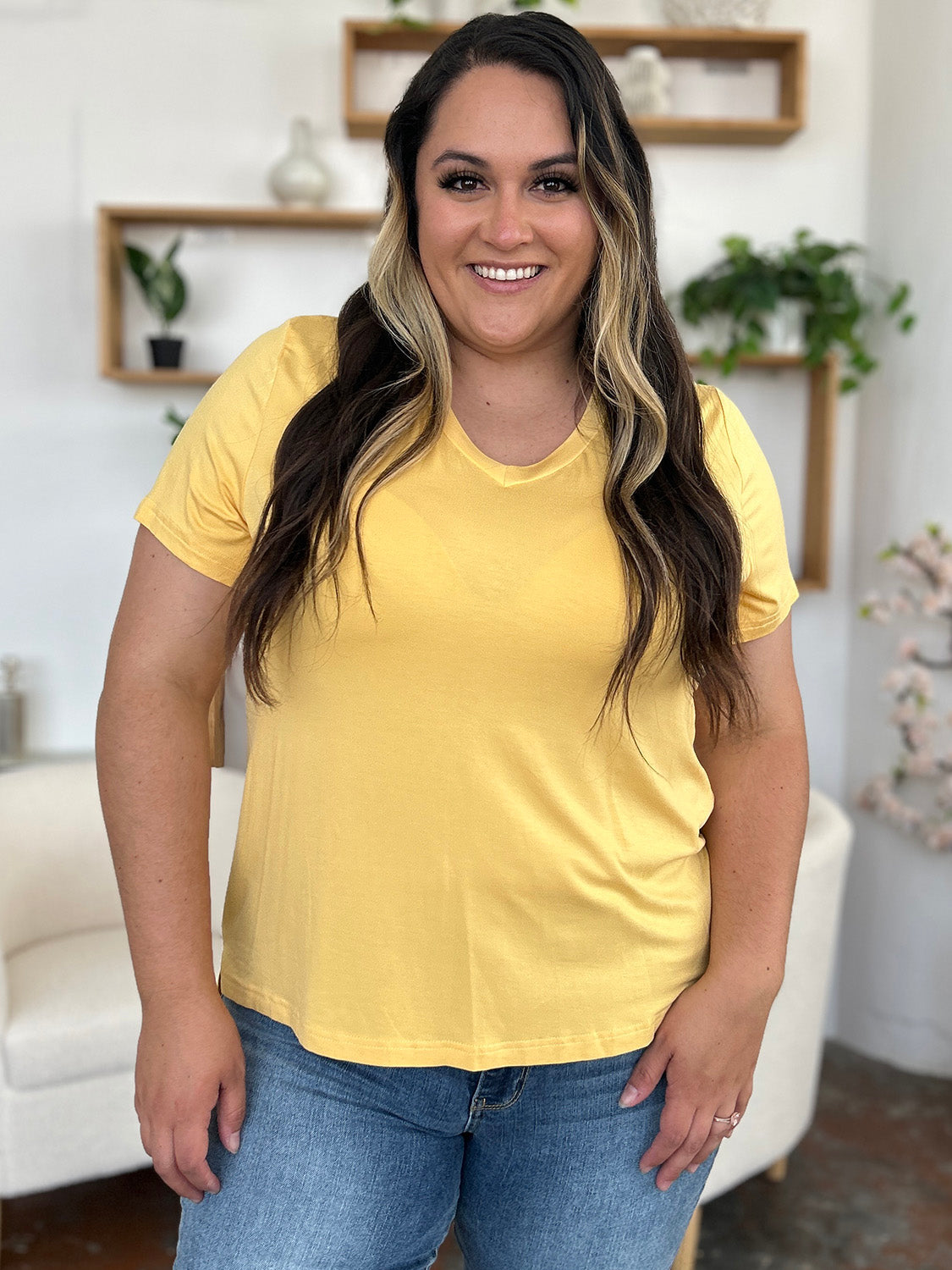 Basic Bae bamboo full size V-neck high-low T-shirt, soft natural fabric, lightweight casual top, in neutral color.
