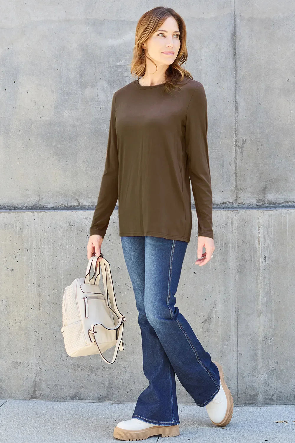 Women's round neck long sleeve top by ShopBasicbae, shown in a relaxed fit with soft fabric and classic design.