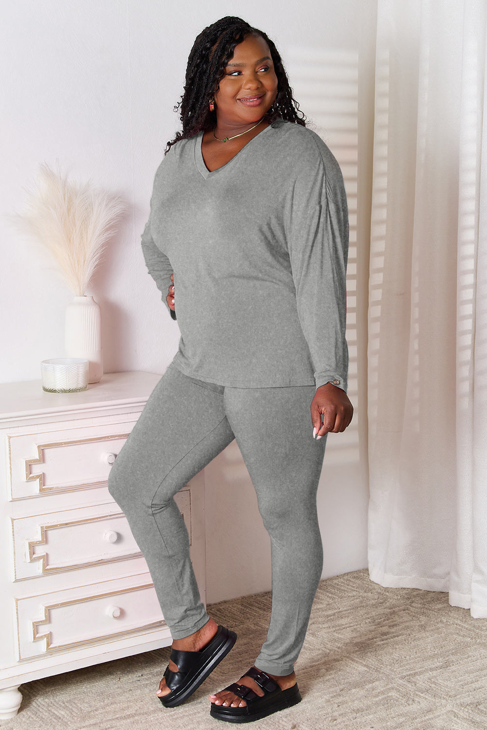 ShopBasicbae bamboo lounge set with full-size v-neck long sleeve top and matching pants, soft and comfortable for relaxed wear.
