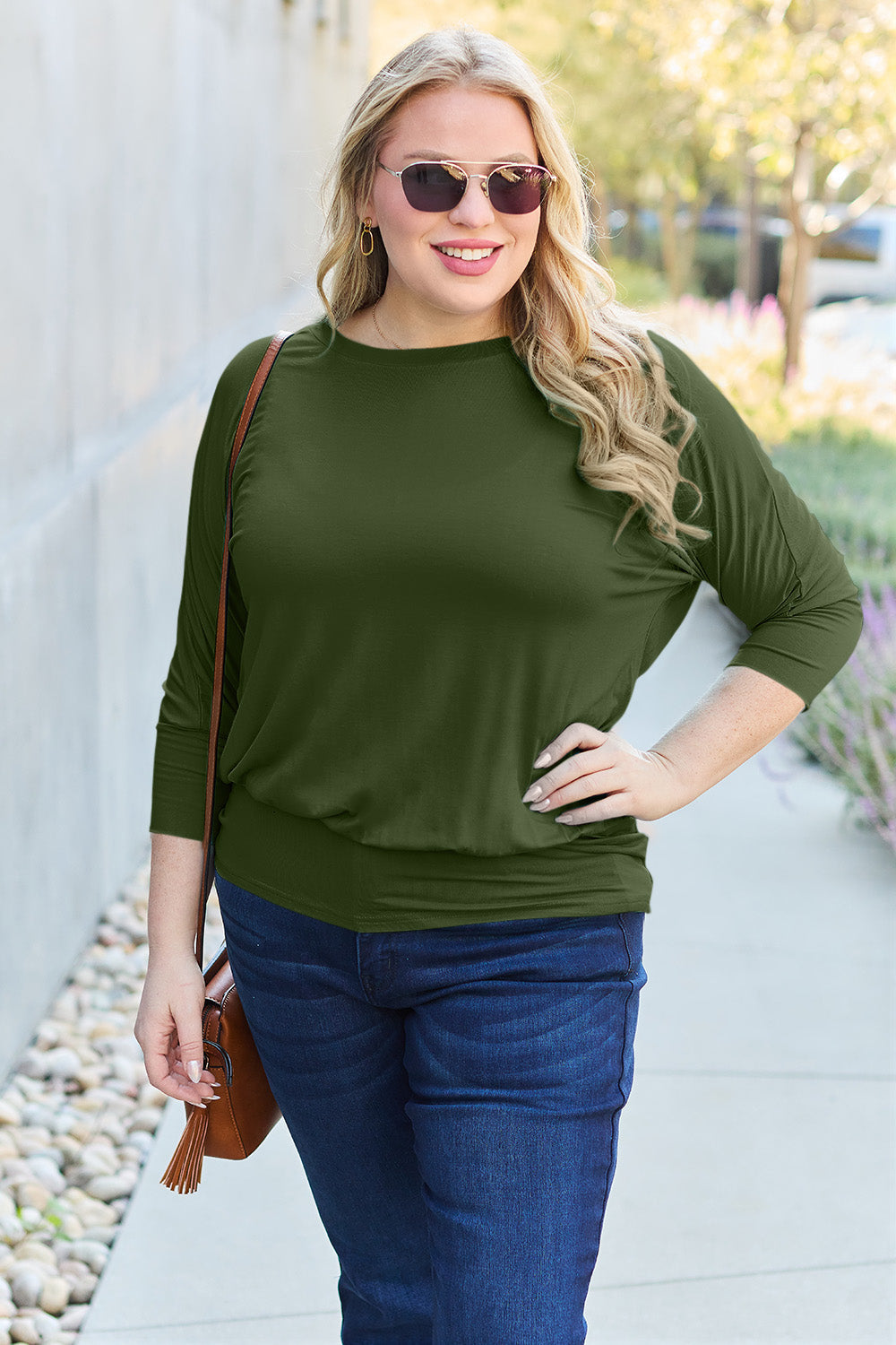 ShopBasicbae Basic Bae full-size round neck batwing sleeve top displayed on a mannequin, showcasing its relaxed fit and stylish design.